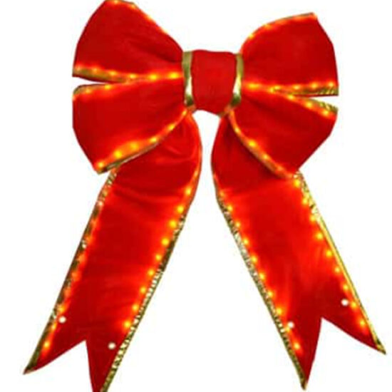 A vibrant red velvet or fabric bow with striking accents. The loops and tails are trimmed with a thin gold border, enhancing the festive look.
