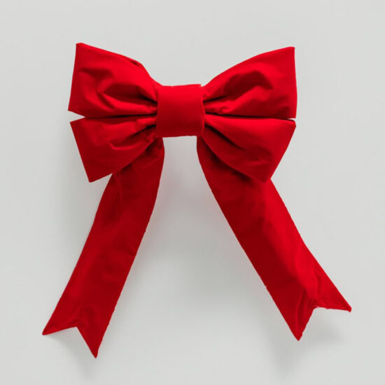 A structured, matte red velvet bow in a classic holiday decoration style, with no trim.