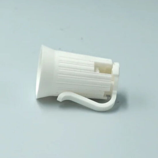 A white plastic, twist-on light bulb socket, likely an E12 size, with a large clip or hook for mounting.