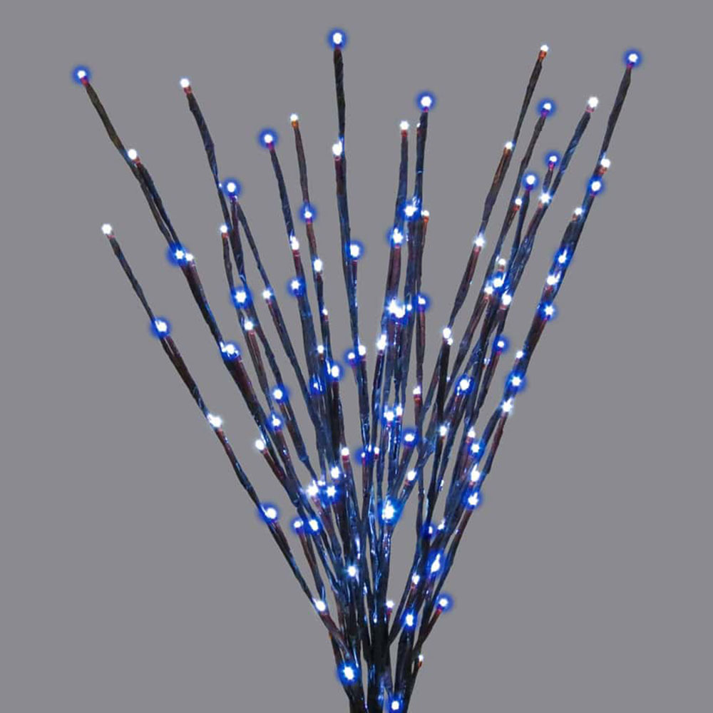A unique illuminated twig bundle with a dual-color scheme. The dark branches are thickly wrapped with blue and bright white LED lights.