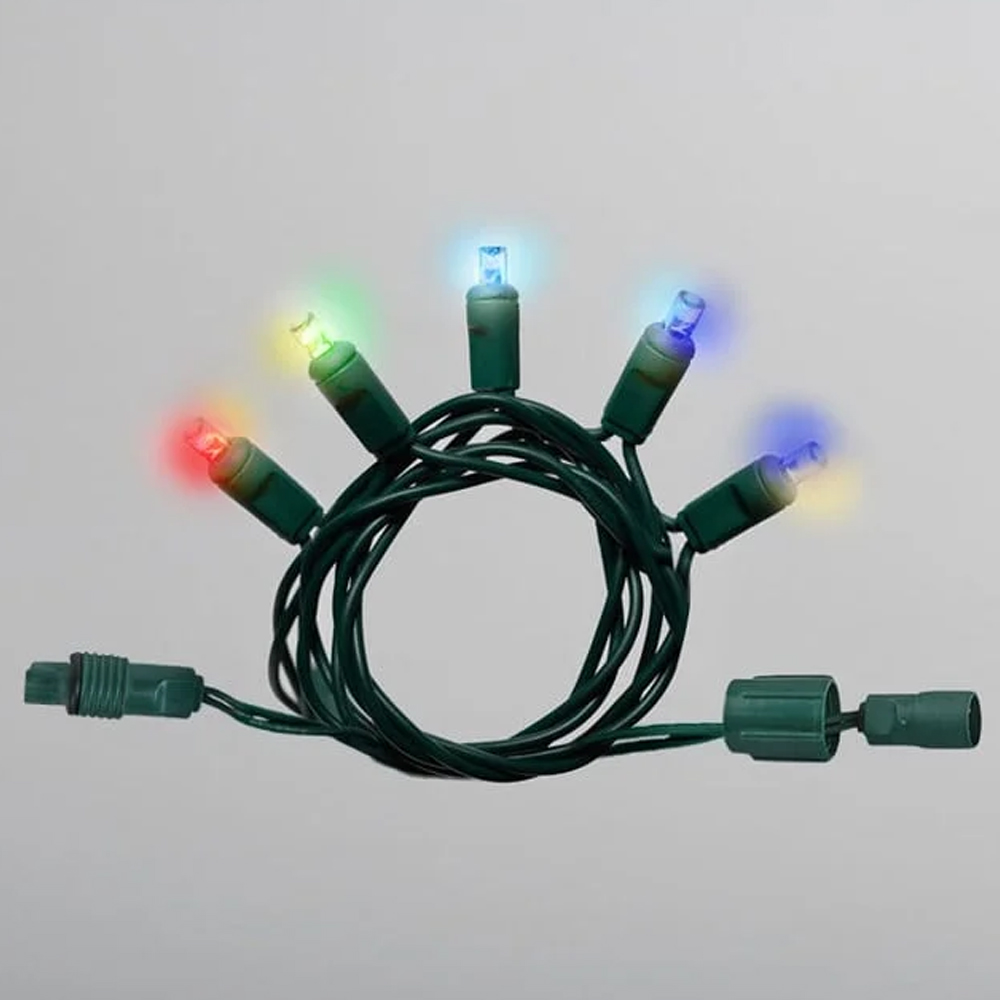 Close-up of a small section of RGBWW string lights on green wire, coiled, with red, yellow, blue, and green LEDs illuminated. Mini Light Sparkle RgbWW 4" 50LC