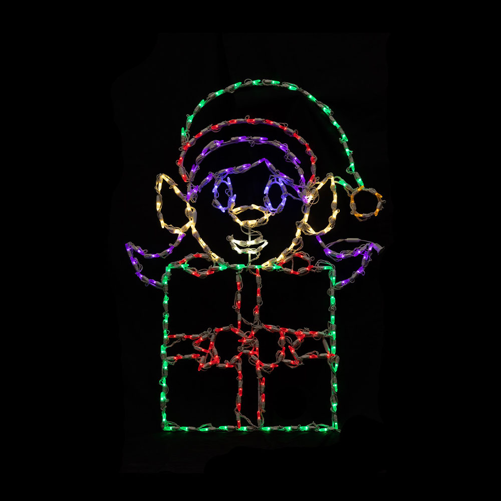 A multi-colored wire frame light motif of an elf figure holding a gift. It uses green, red, purple, and warm white rope/string lights.