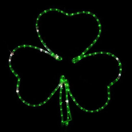 A three-leaf clover (shamrock) light motif for St. Patrick's Day. The silhouette is formed by green LED or incandescent rope light, mounted on a hidden wire frame.