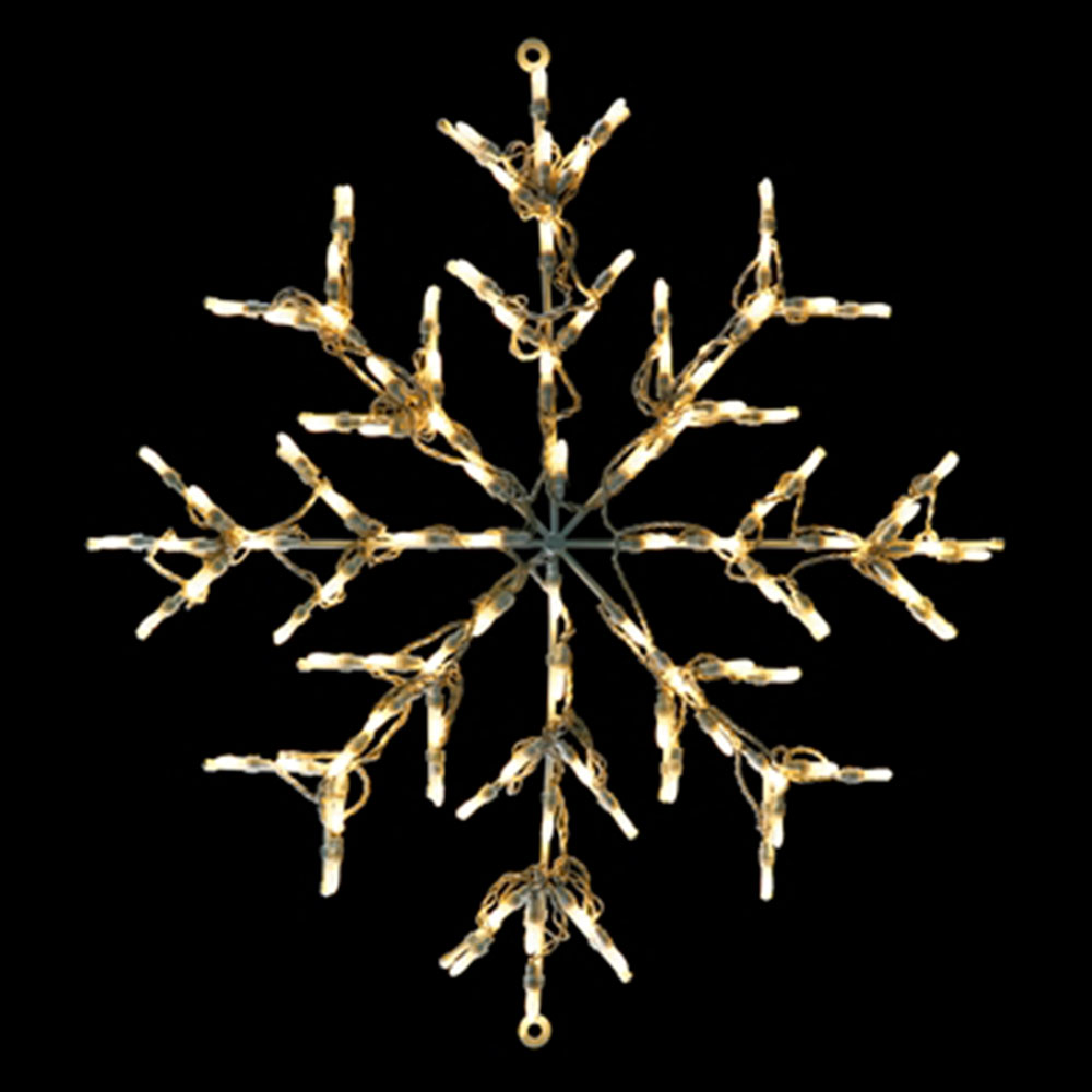 A snowflake light motif featuring a six-pointed radial design. The display is constructed on a metal/wire frame and fully illuminated with warm white/yellow incandescent or LED string lights.