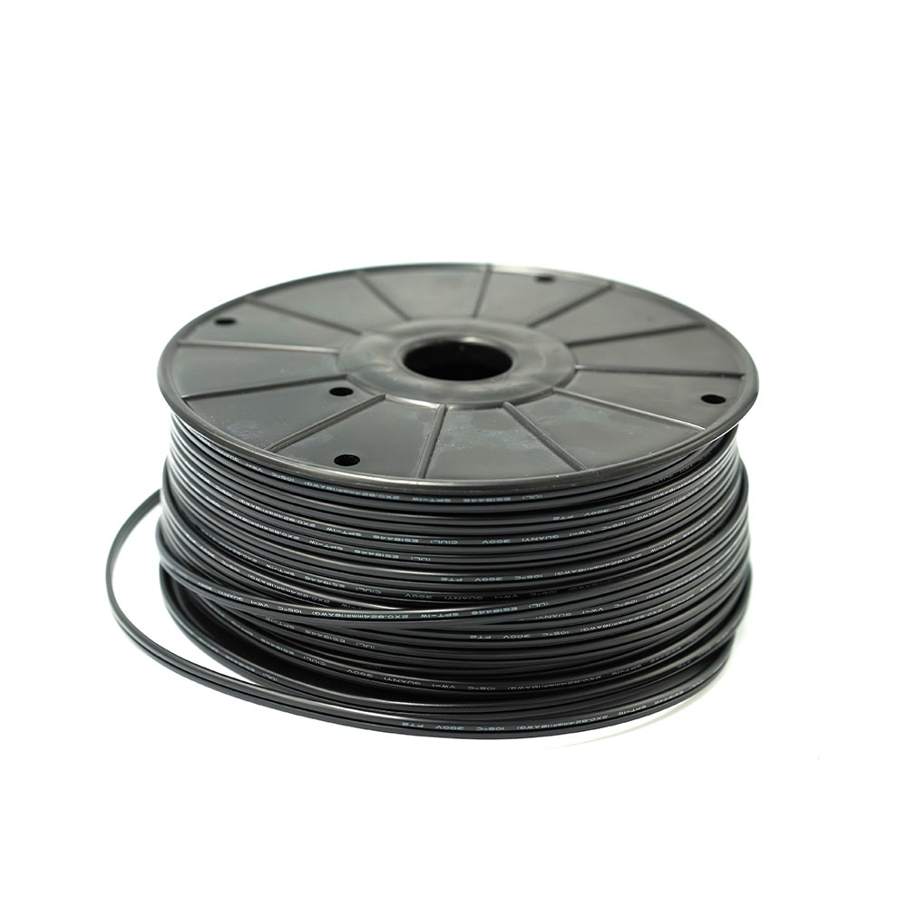 A large coil of thin, black insulated electrical wire, neatly spooled onto a plastic reel.