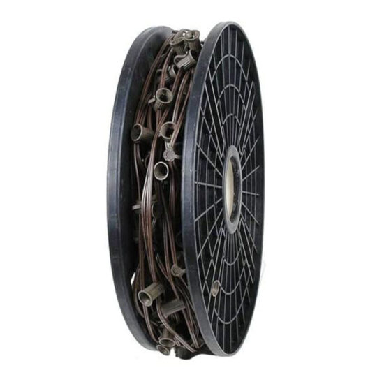 A large black plastic reel holding a coil of brown electrical wire with attached light bulb sockets.