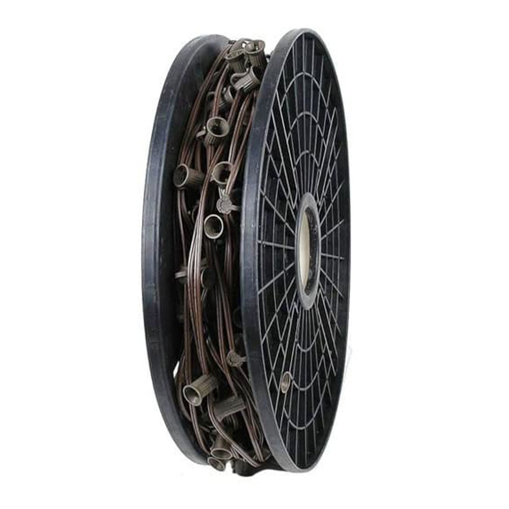 A large black plastic reel holding a coil of brown electrical wire with attached light bulb sockets.