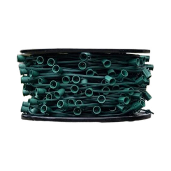 Closeup of a black reel packed tightly with bulk green wire and numerous snap-in or screw-in empty light bulb holders