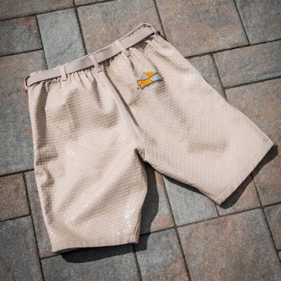 Beige/tan anti-slip safety shorts designed for roof work, featuring a textured, grip-enhancing rubber pattern and a small SteepGear logo. SteepGear Roof Safety Anti-Slip Shorts with Sticky Rubber
